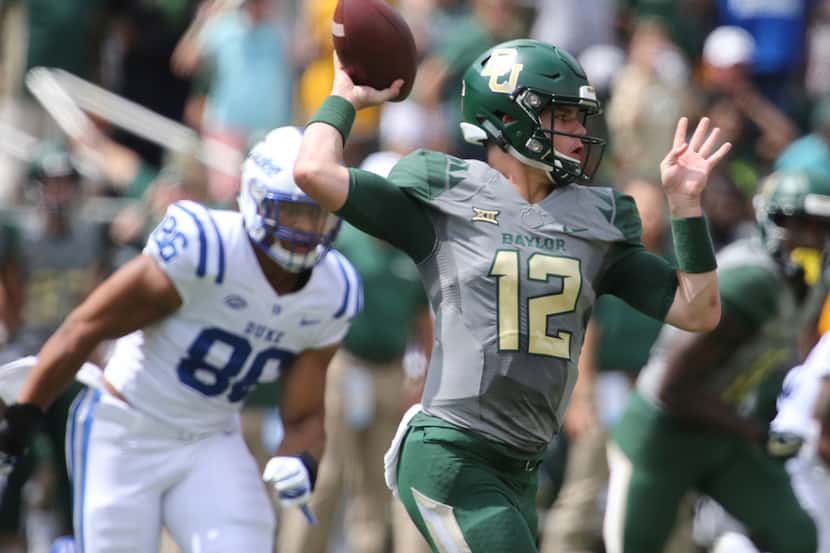 Baylor quarterback Charlie Brewer (12) throws down field against Duke in the first half of...