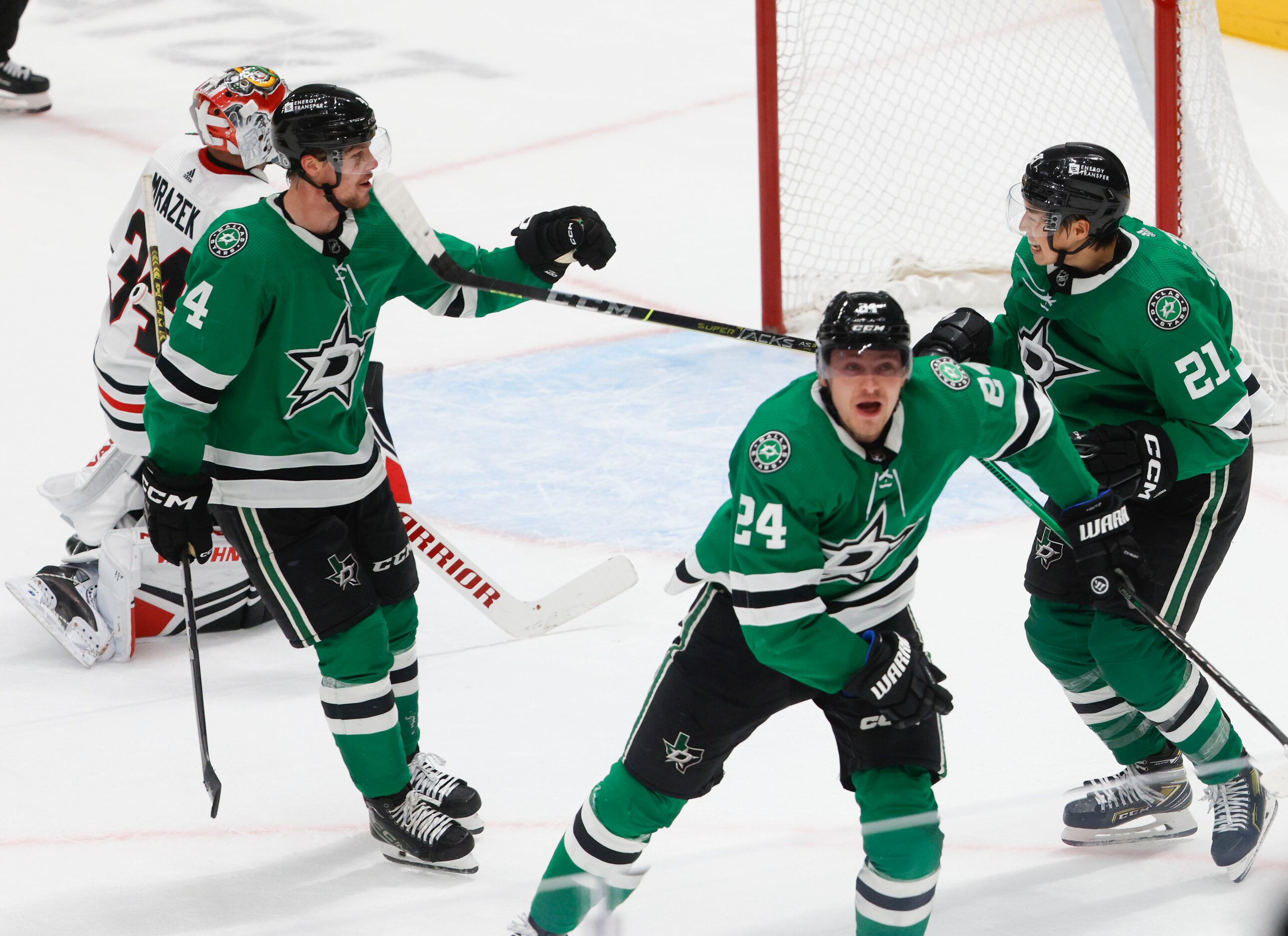 Dallas Stars center Roope Hintz (24) celebrates with Miro Heiskanen (4) and left wing Jason...