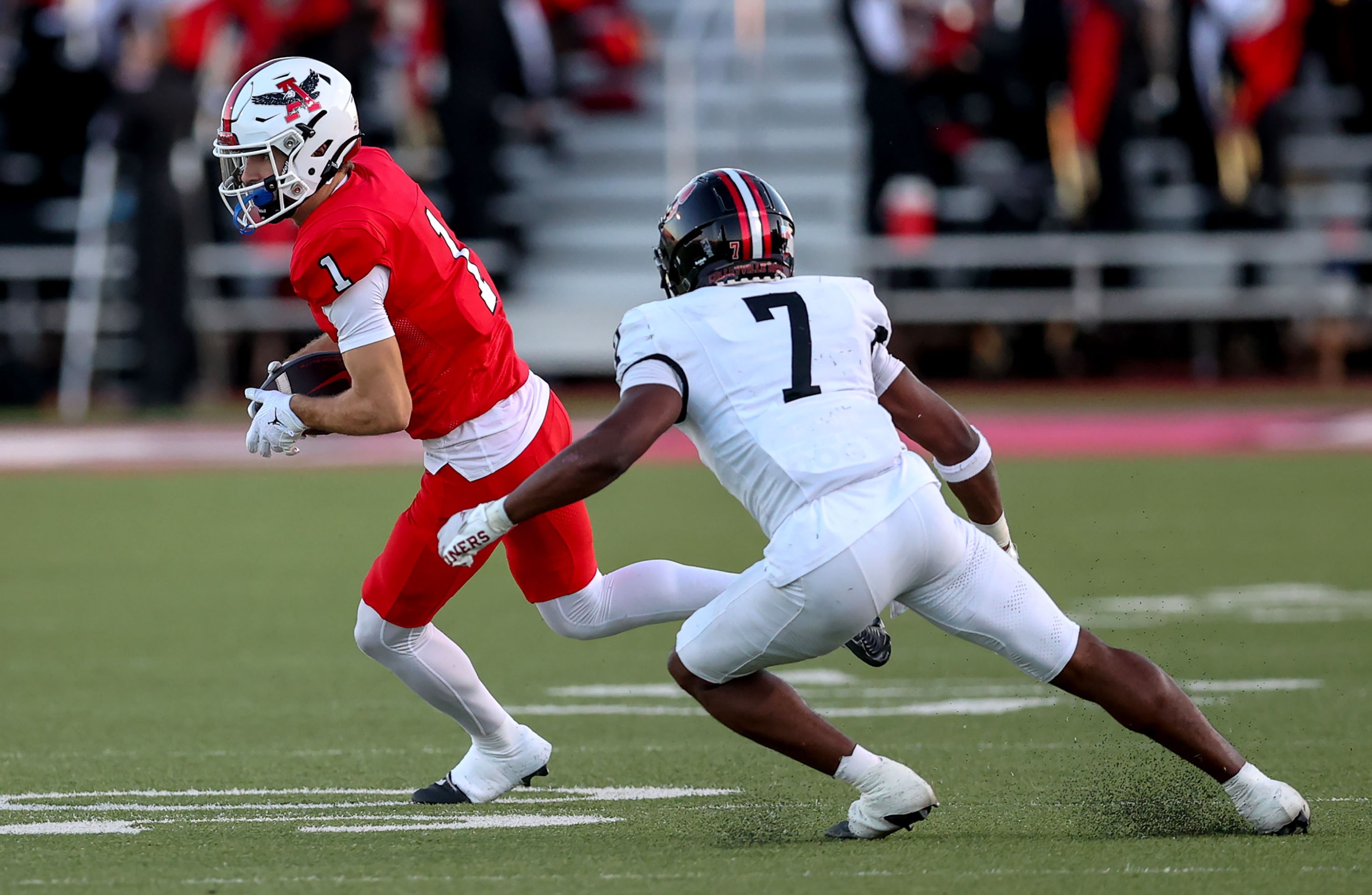 Argyle wide receiver Will Krzysaik (1) tries to get past Colleyville Heritage defensive back...