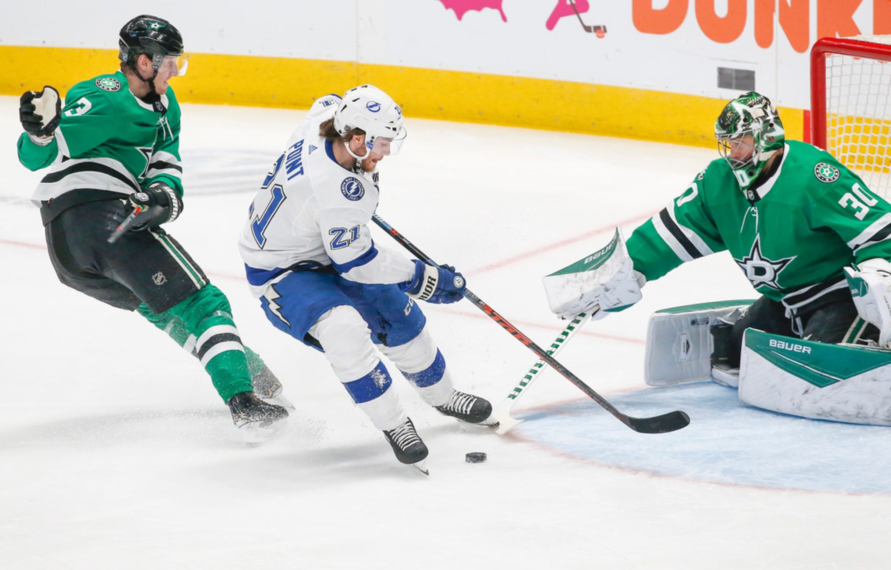 Dallas Stars goaltender Ben Bishop (30) blocks a shot by Tampa Bay Lightning center Brayden...