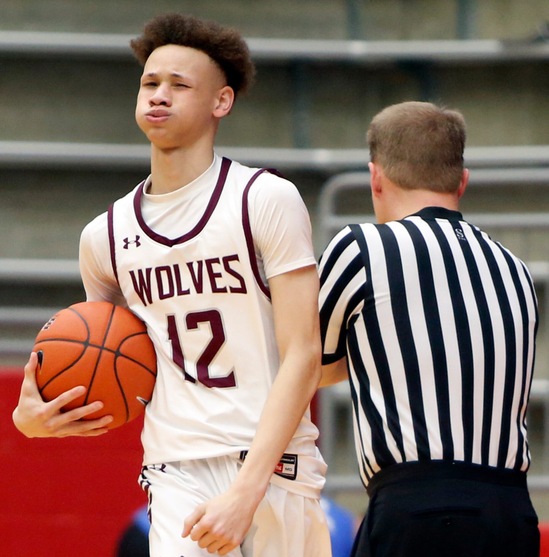 Mansfield Timberview sophomore Chendall Weaver (12) reacts after being called for a foul...