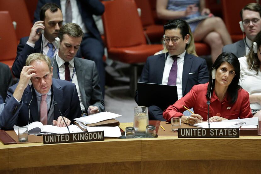 United Kingdom U.N. Ambassador Matthew Rycroft, left, and United States U.N. Ambassador...