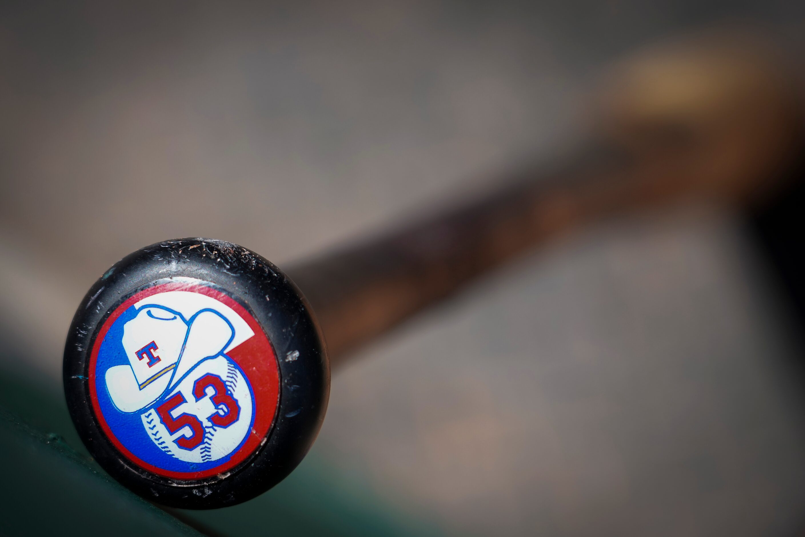 Texas Rangers outfielder Adolis García’s bat rests in the dugout before a spring training...