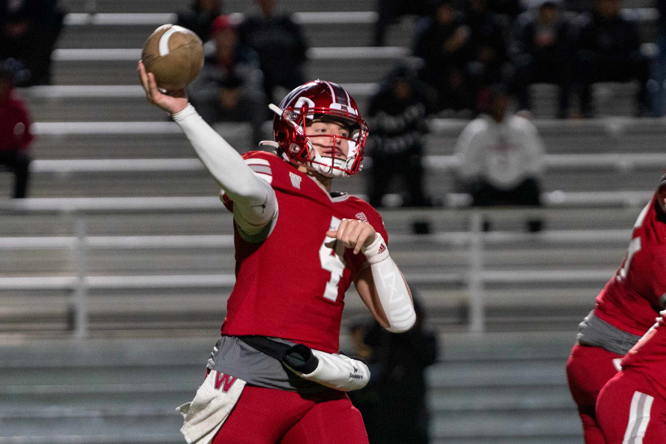 Woodrow Wilson junior quarterback Cam McGuire (4) throws a pass during the first half of a...