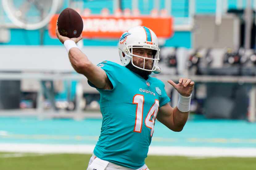 Miami Dolphins quarterback Ryan Fitzpatrick (14) warms up before an NFL football game...