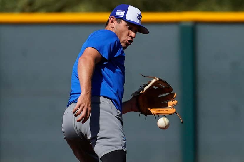 Israel Olympic baseball player Ian Kinsler takes fielding practice at Salt River Fields...