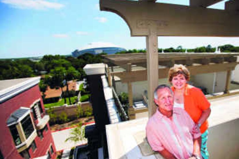  Steve Burdick and Persis Ann Forster, at home on their rooftop deck at Chelsea Park, are...