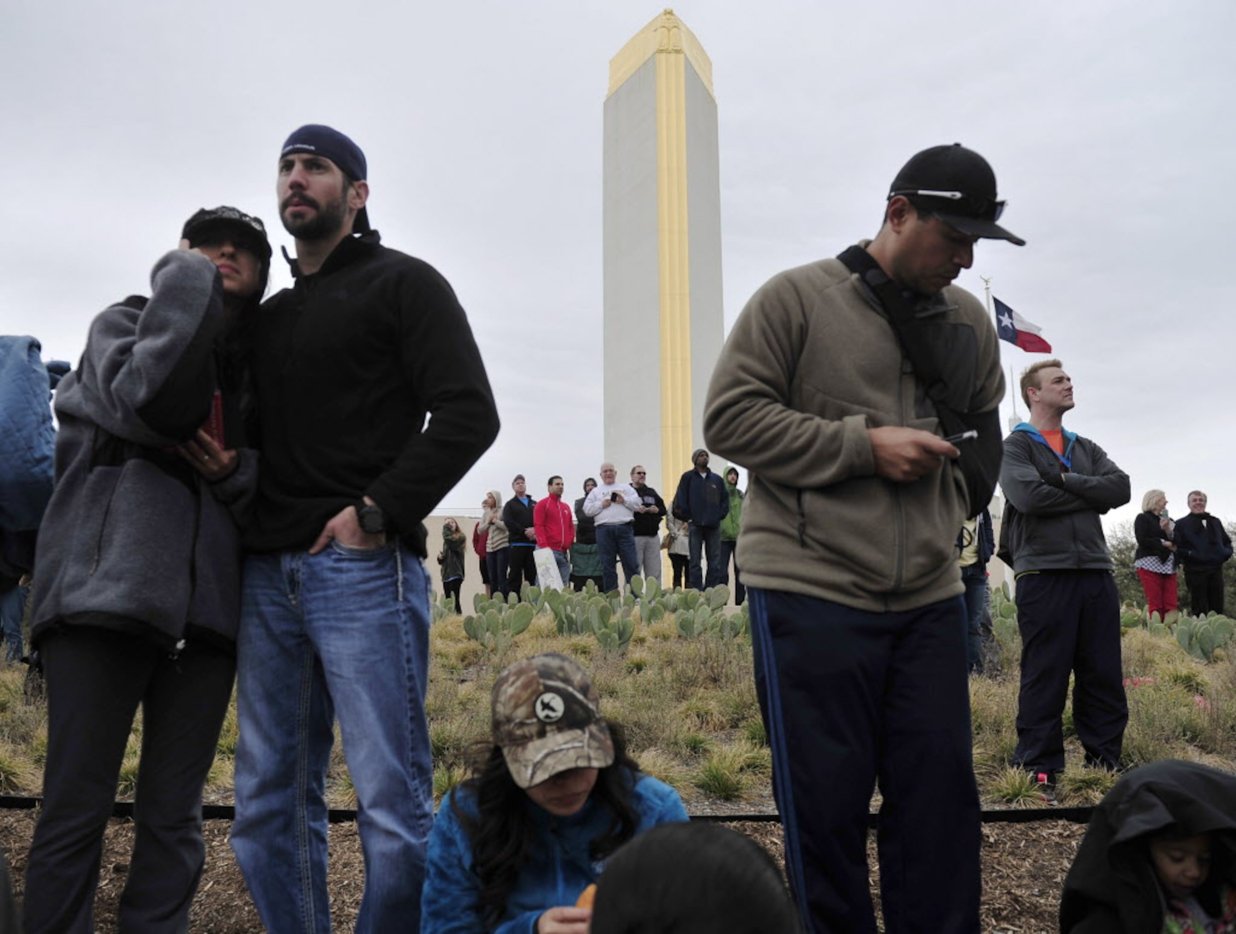 Spectators wait for friends and family to cross the finish line during the Dallas Rock N'...