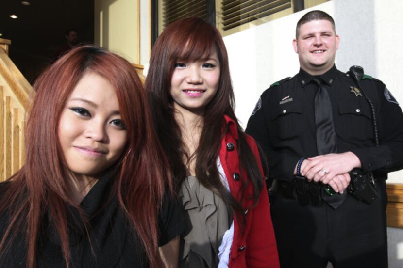 Ngoc Do (left) and Nhi Tran got to meet the Rockwall County sheriff's deputy who pulled them...