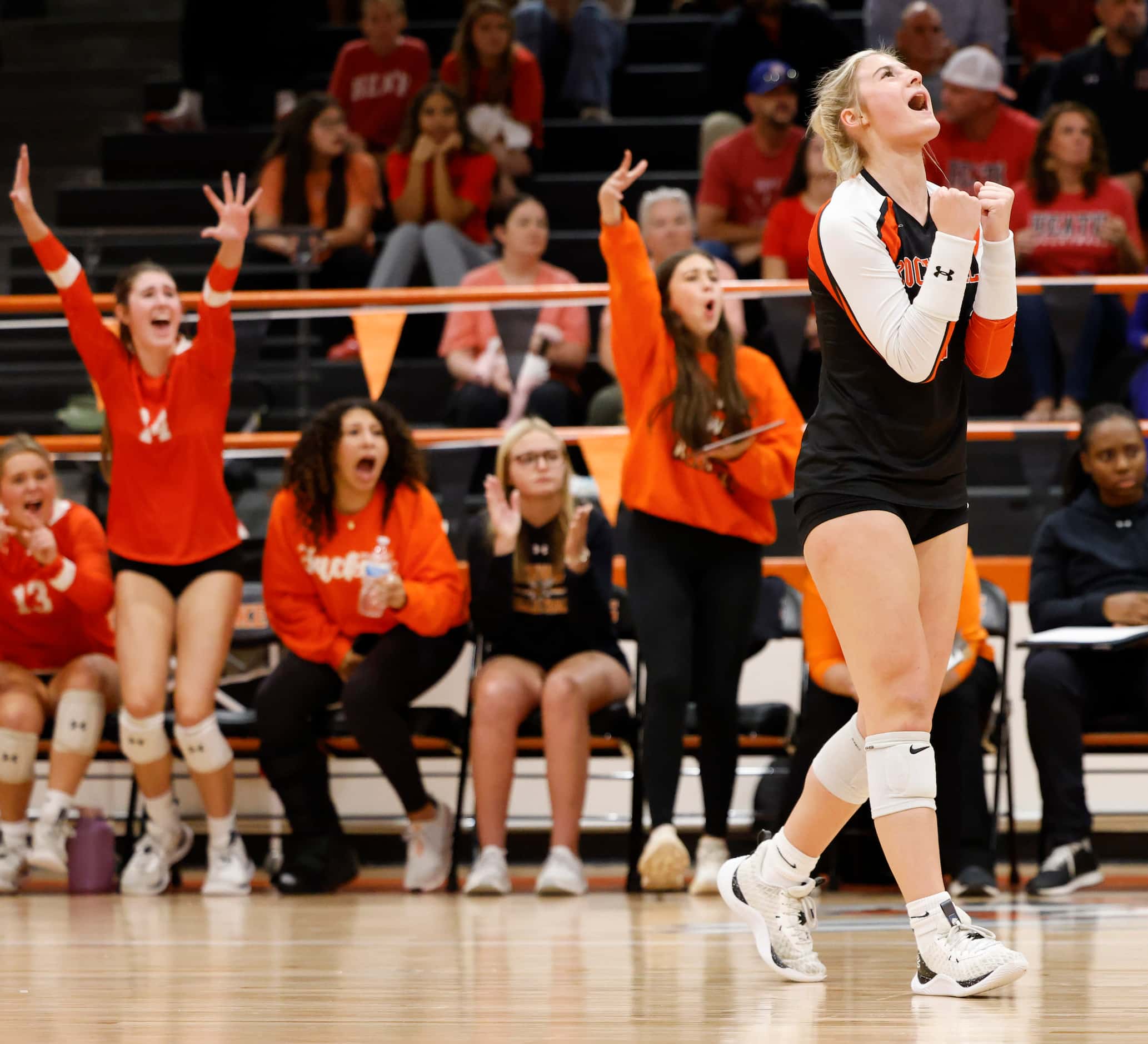 Rockwall high’s Sophia Armstrong cheers after a point against Rockwall heath during a...