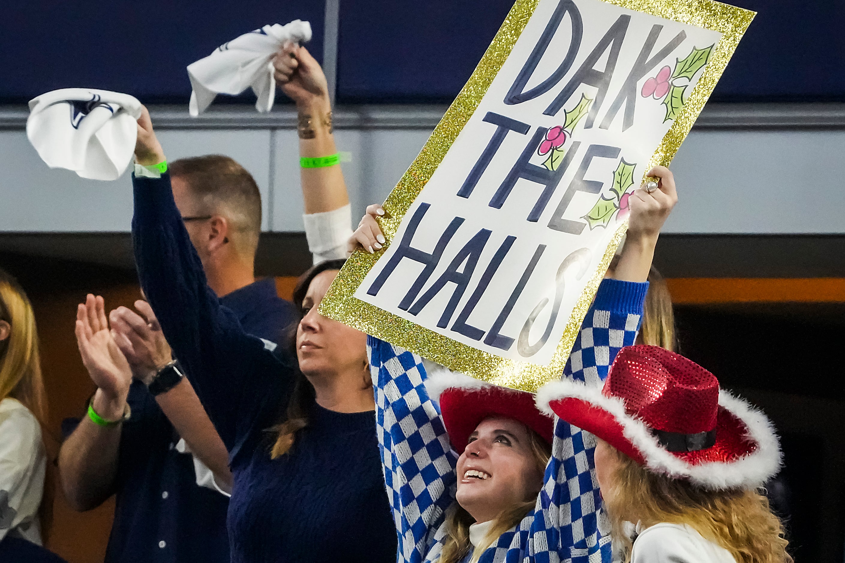 Fans cheer Dallas Cowboys quarterback Dak Prescott during the second half of an NFL football...