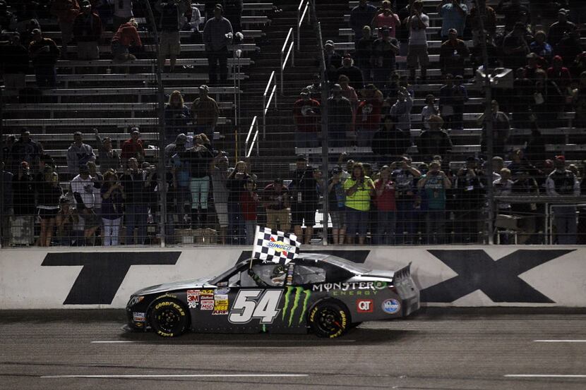 NASCAR Nationwide Series Kyle Busch, driver of the (54) Monster Energy Toyota,  celebrates...