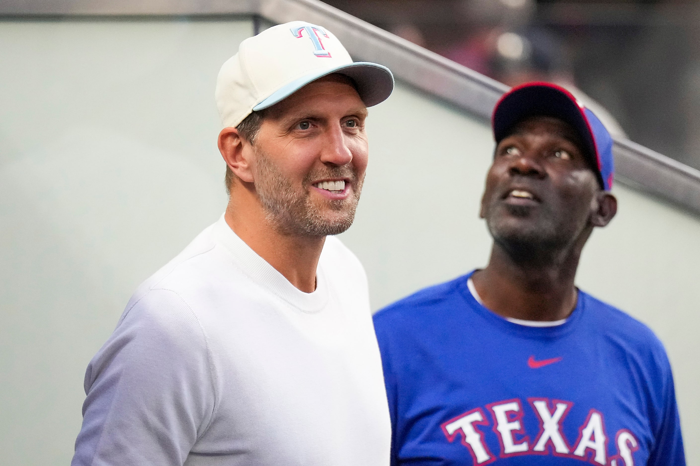 Former Dallas Mavericks Dirk Nowitzki and Michael Finley in attendance prior to the start of...