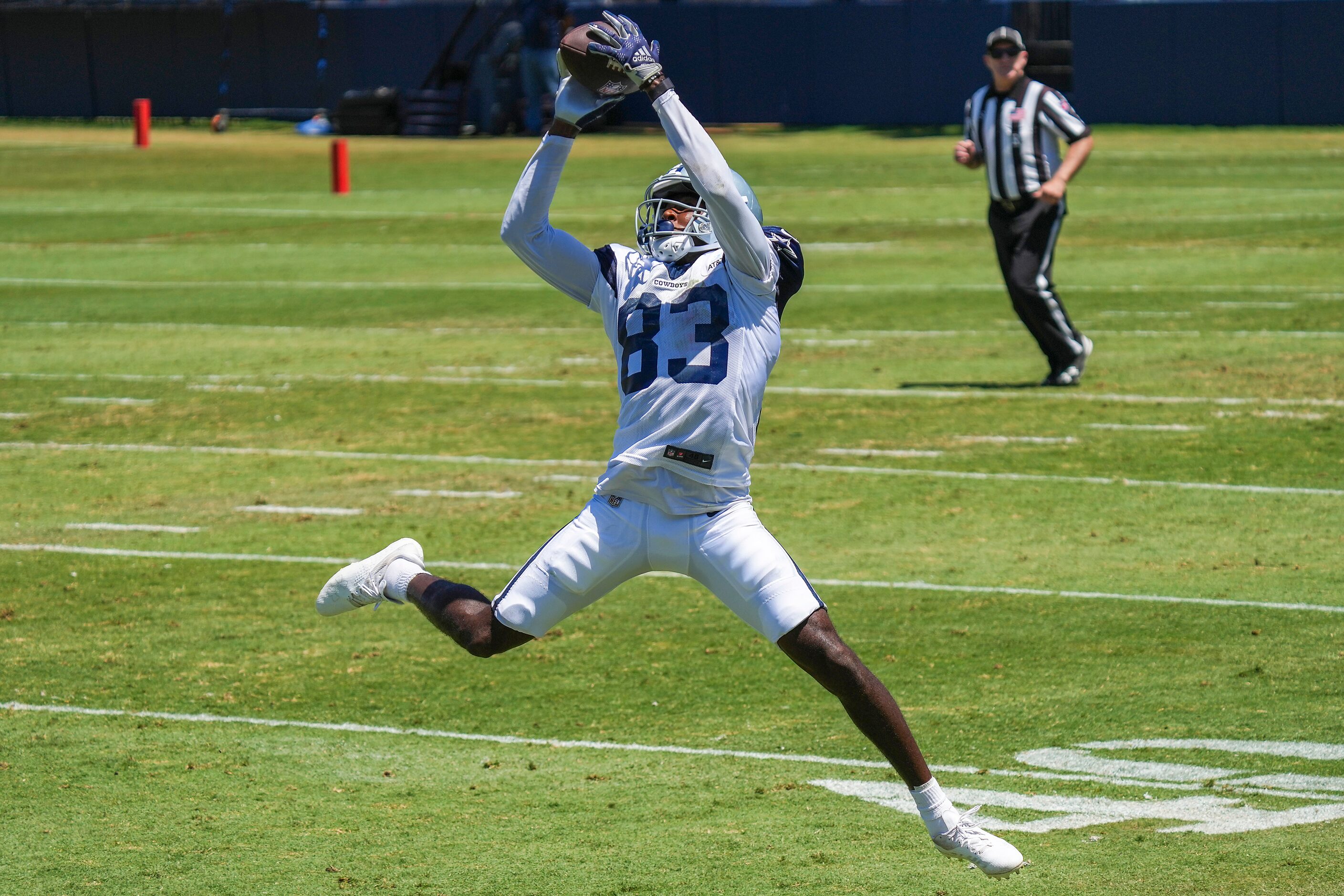 Dallas Cowboys wide receiver Jalen Brooks (83) makes a leaping catch during a training camp...