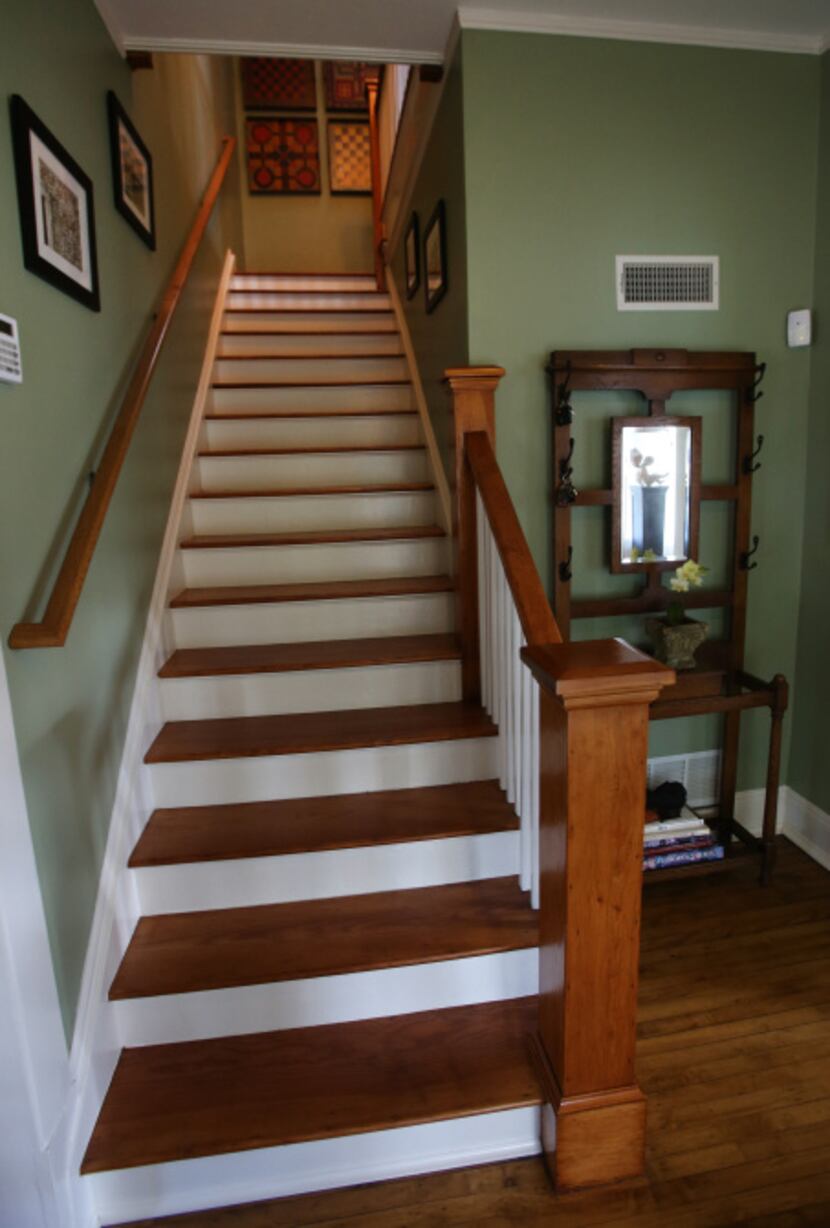A look at the staircase from the foyer of Jackie and Doug Sweat's home on Junius Street in...