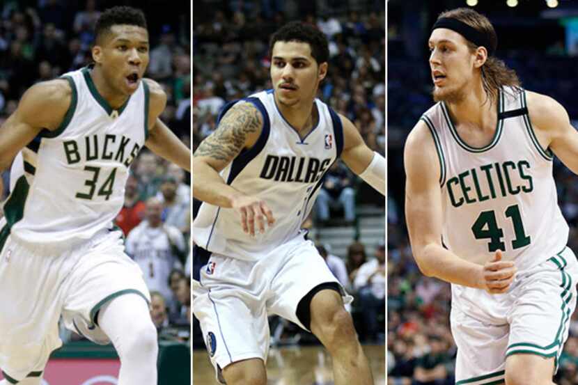 Pictured from L to R: Milwaukee's Giannis Antetokounmpo / former Maverick Shane Larkin /...