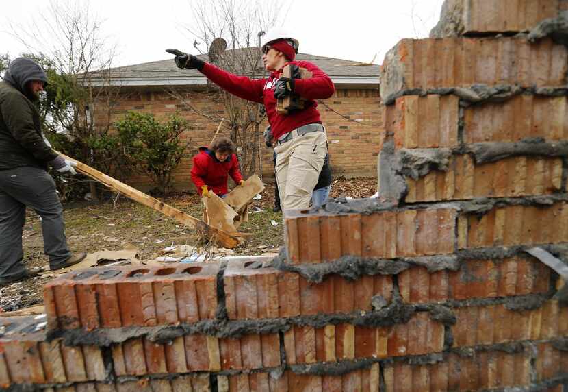 Team Rubicon volunteer Megan Johnson gives direction to volunteers of the West Texas...