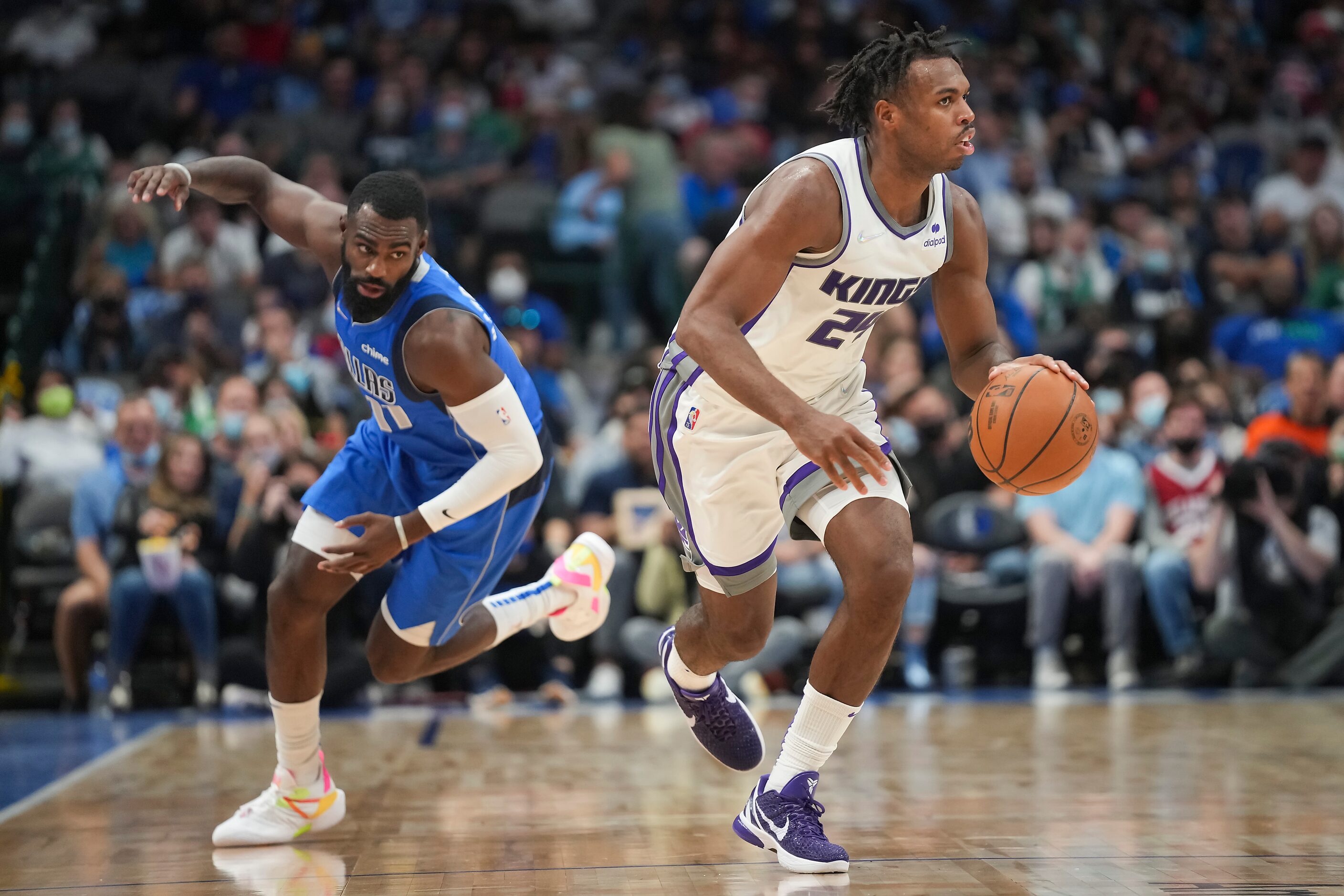 Sacramento Kings guard Buddy Hield (24) steals the ball from Dallas Mavericks forward Tim...