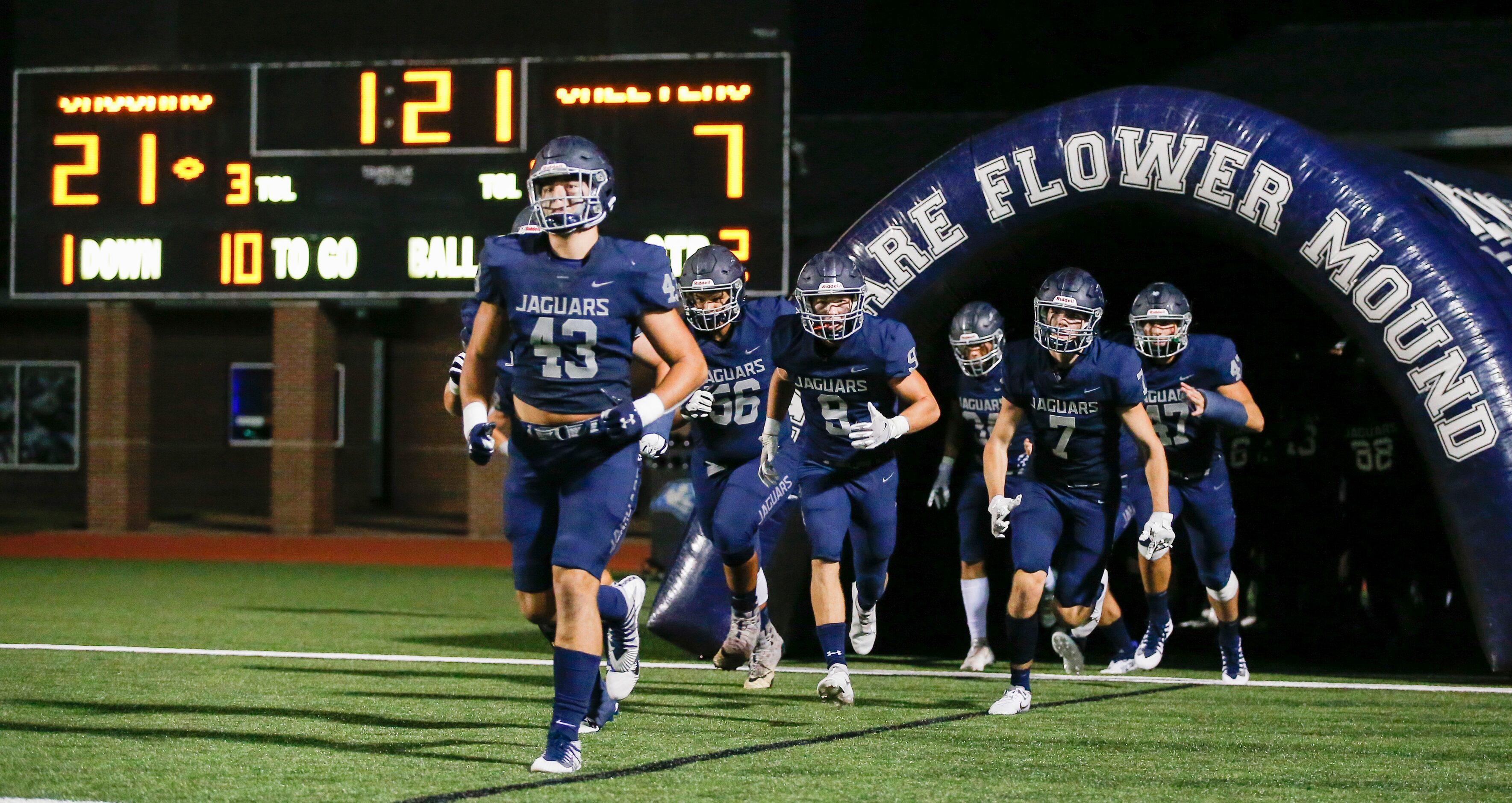 Flower Mound takes the field for the second half a high school football game against...