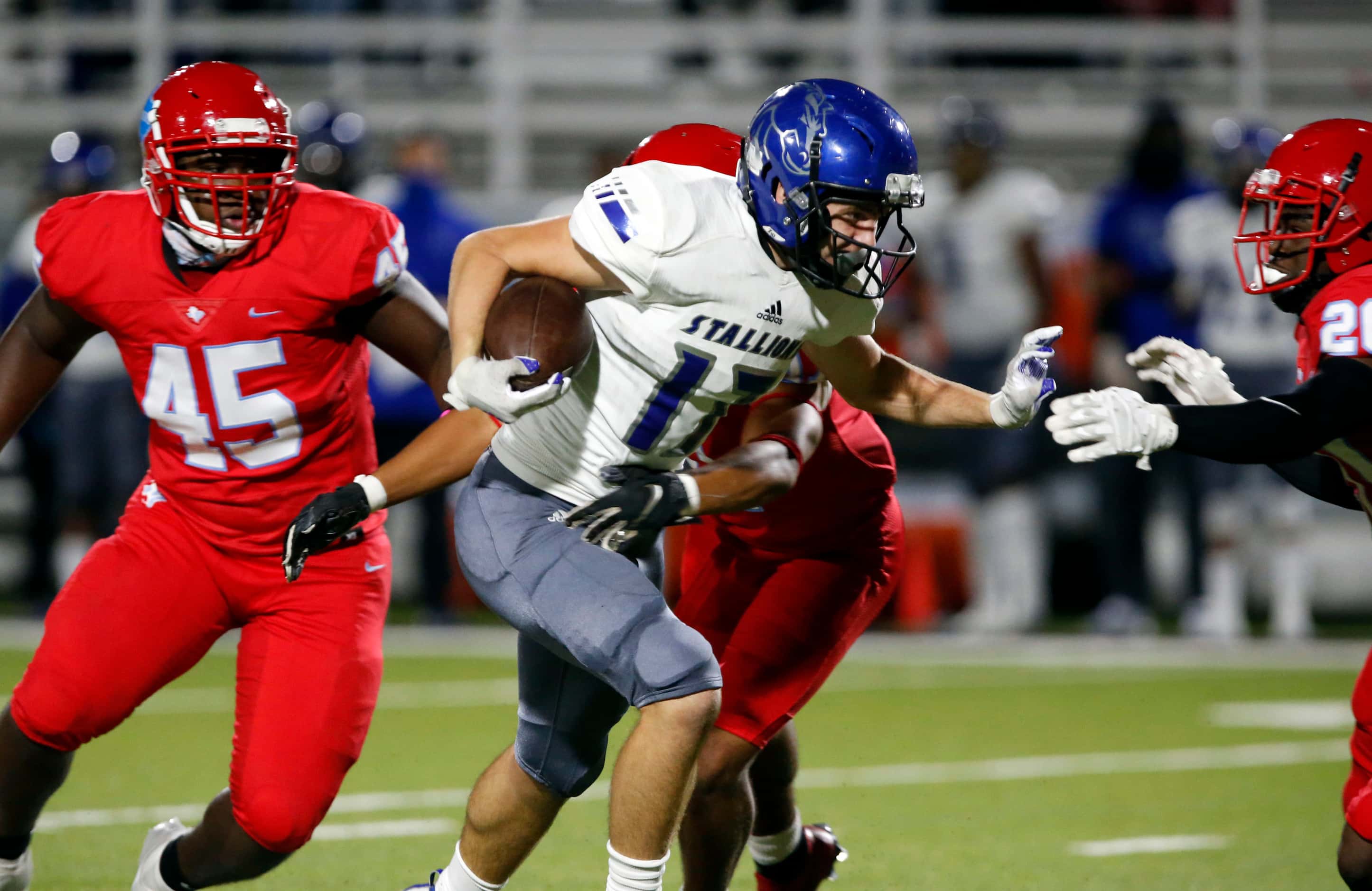 North Mesquite's Marcus Yow (17) picks up a couple of yards during the first half of a high...