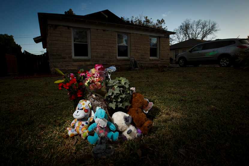 A small memorial sits in the front yard of a home in the 1400 block of Williams Drive where...
