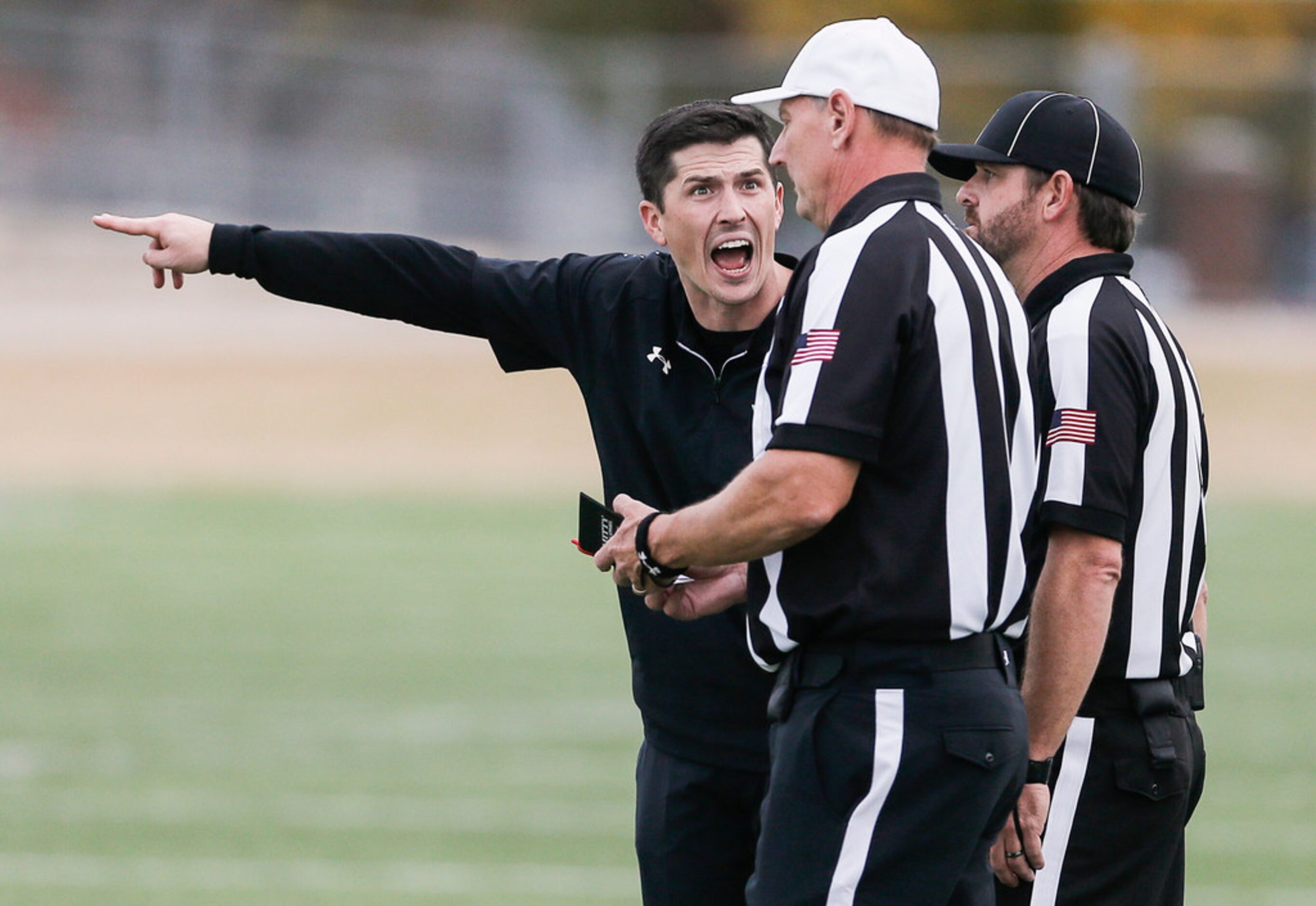 TXHSFB Southlake Carroll head coach Riley Dodge argues a call to the referees during the...