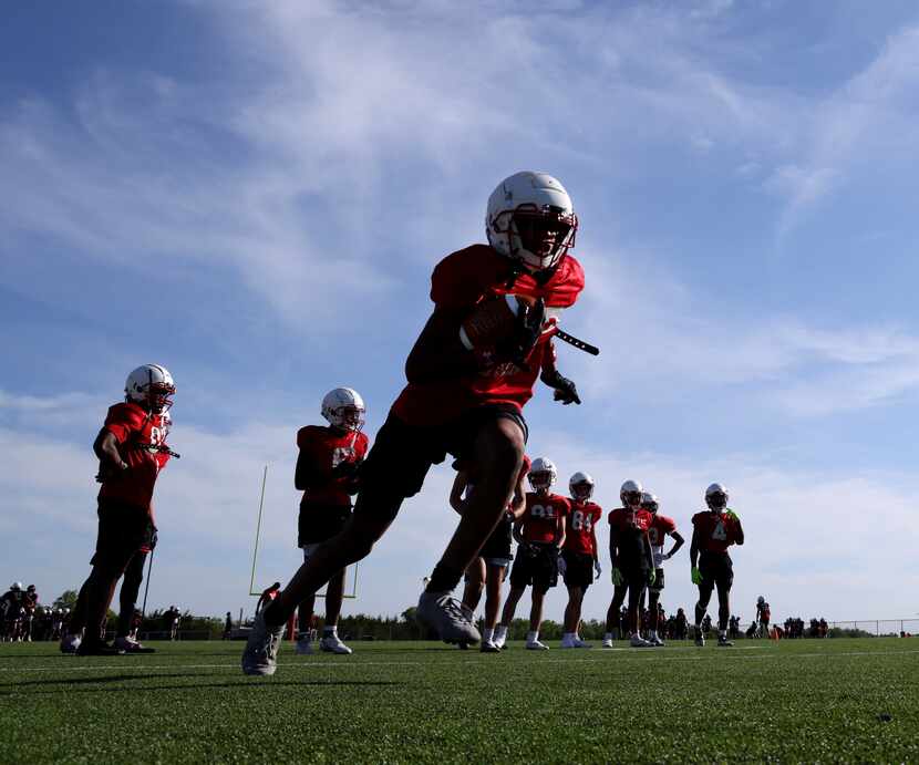 Rockwall-Heath football players were in full force for the team's spring practice under the...