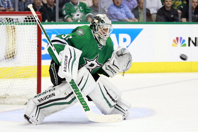 Dallas Stars goalie Antti Niemi (31) eyes a St. Louis Blues shot on goal before catching it...