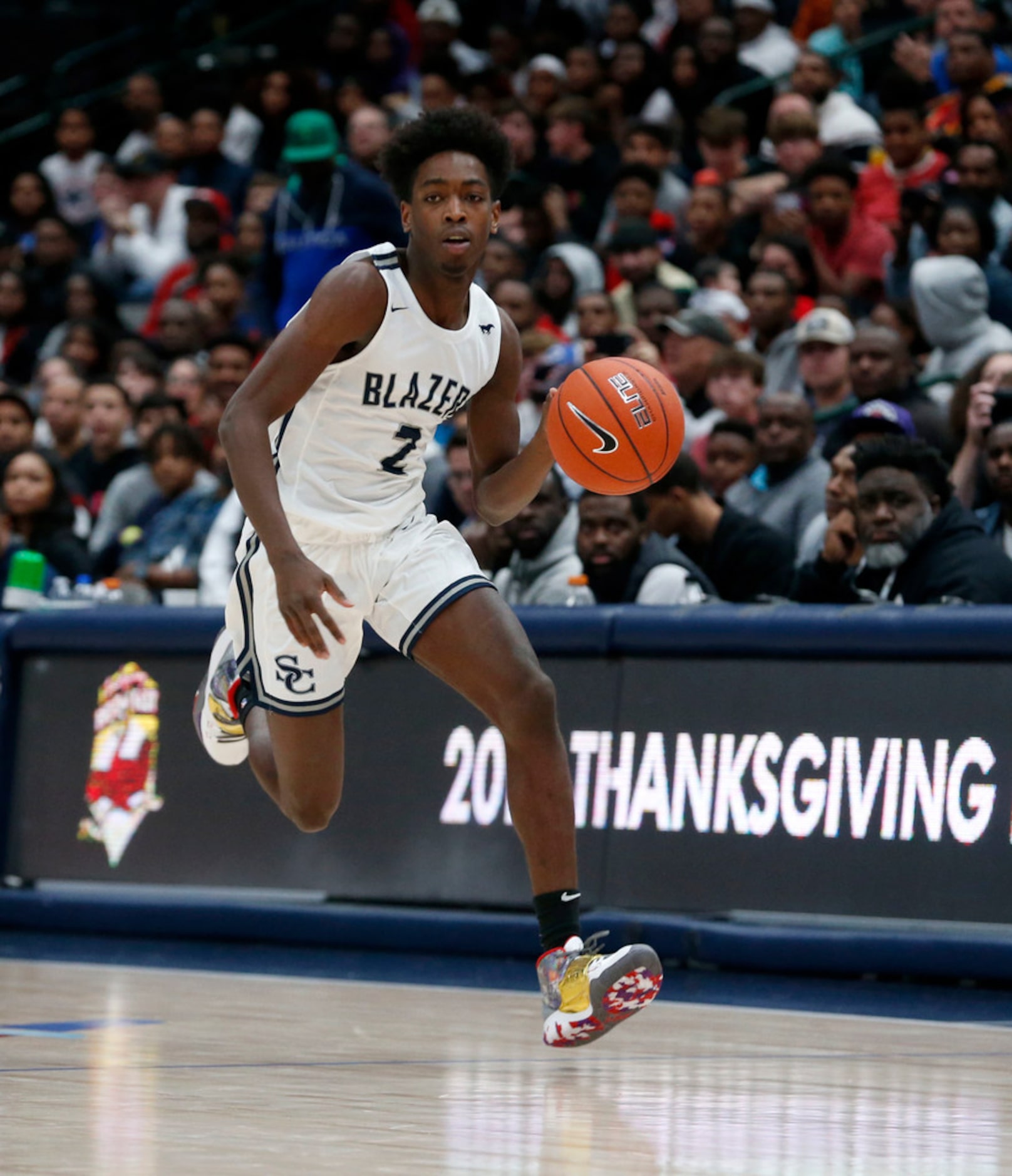 Zaire Wade (2) dribbles the ball up the court against Duncanville during their high school...