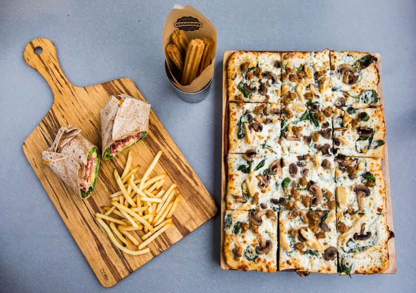 
From left, a club wrap with french fries, churros and a Cali Alfredo pizza are among new...