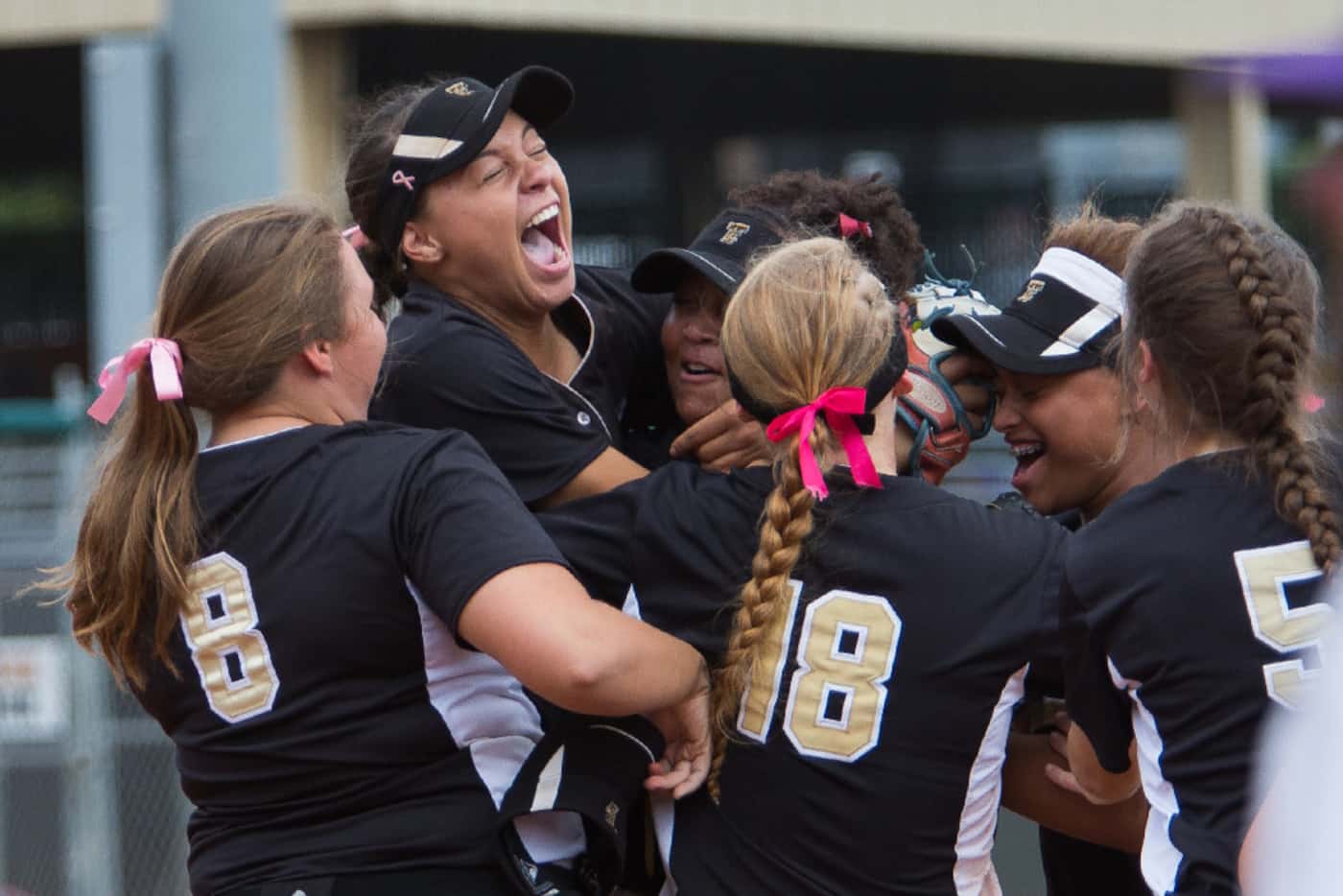 Jayda Coleman, second from left, celebrates making a catch for the final out of the...