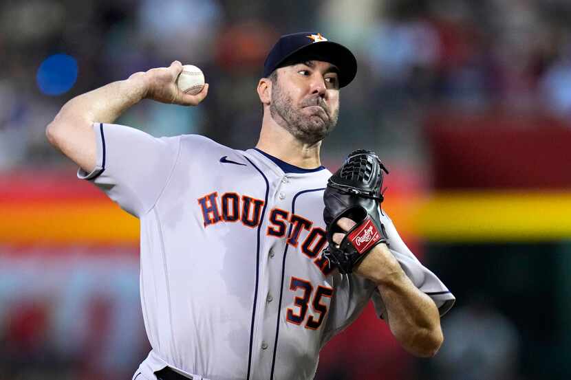 Houston Astros starting pitcher Justin Verlander throws to an Arizona Diamondbacks batter...