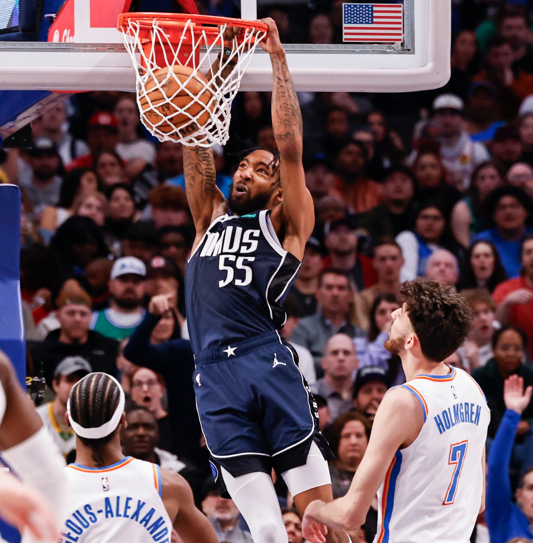 Dallas Mavericks forward Derrick Jones Jr. (55) dunks the ball against Oklahoma City Thunder...