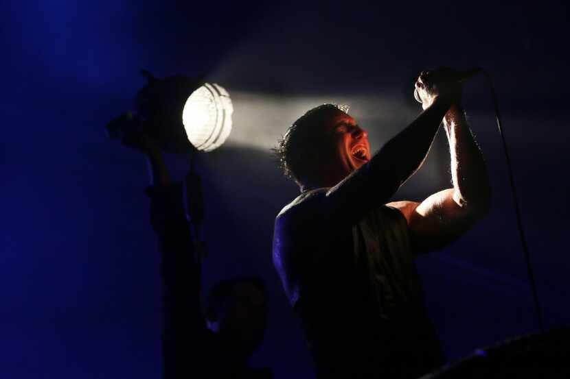Trent Reznor sings during Nine Inch Nails' performance at Gexa Energy Pavilion in Dallas...