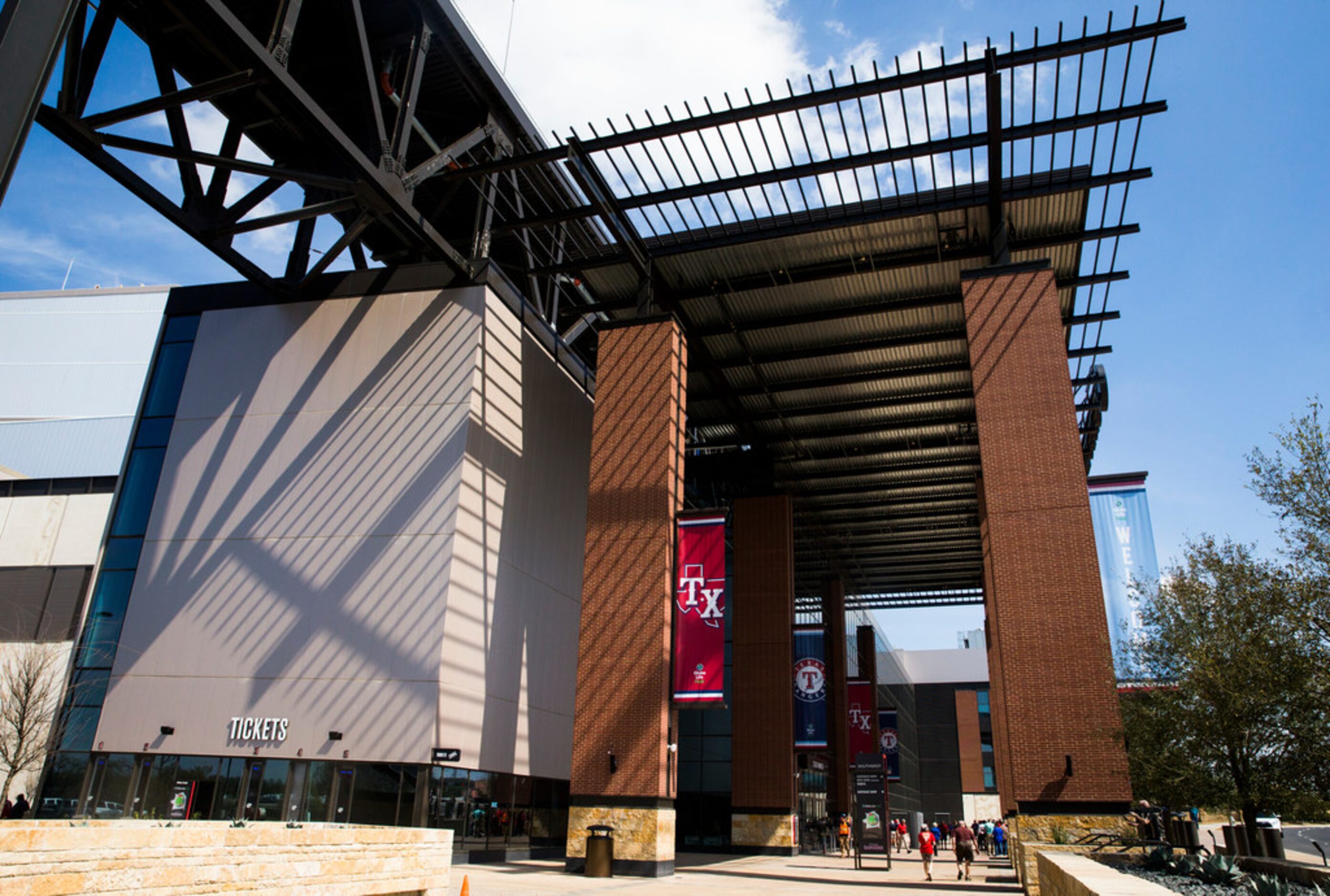 Visitors walk toward the south entrance of the stadium during an open house for the Texas...