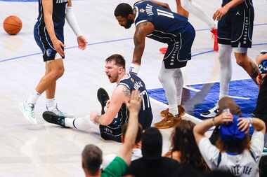 Dallas Mavericks guard Luka Doncic (77) reacts after being called for his fifth foul of the...