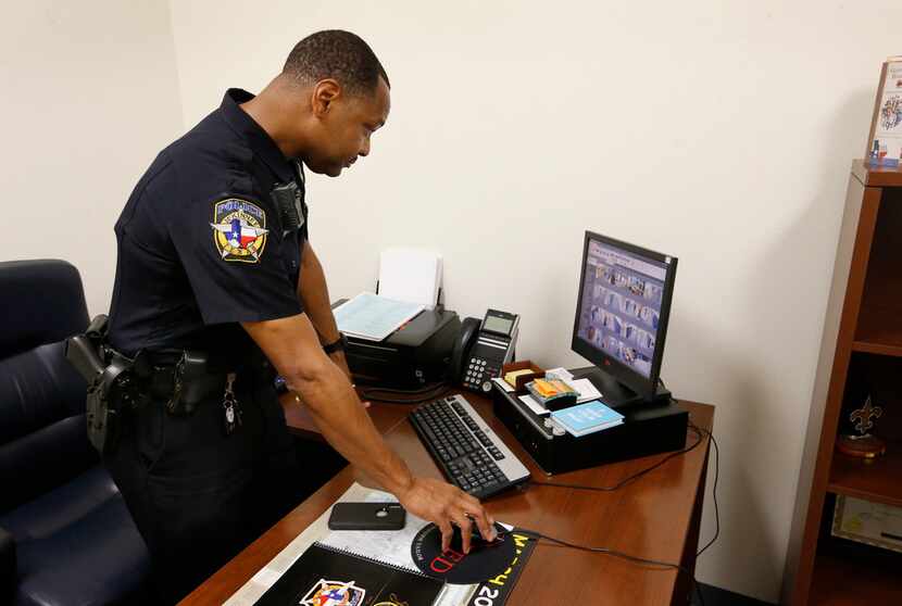 McKinney police officer Bryant Bailey demonstrates the security system at McKinney North...