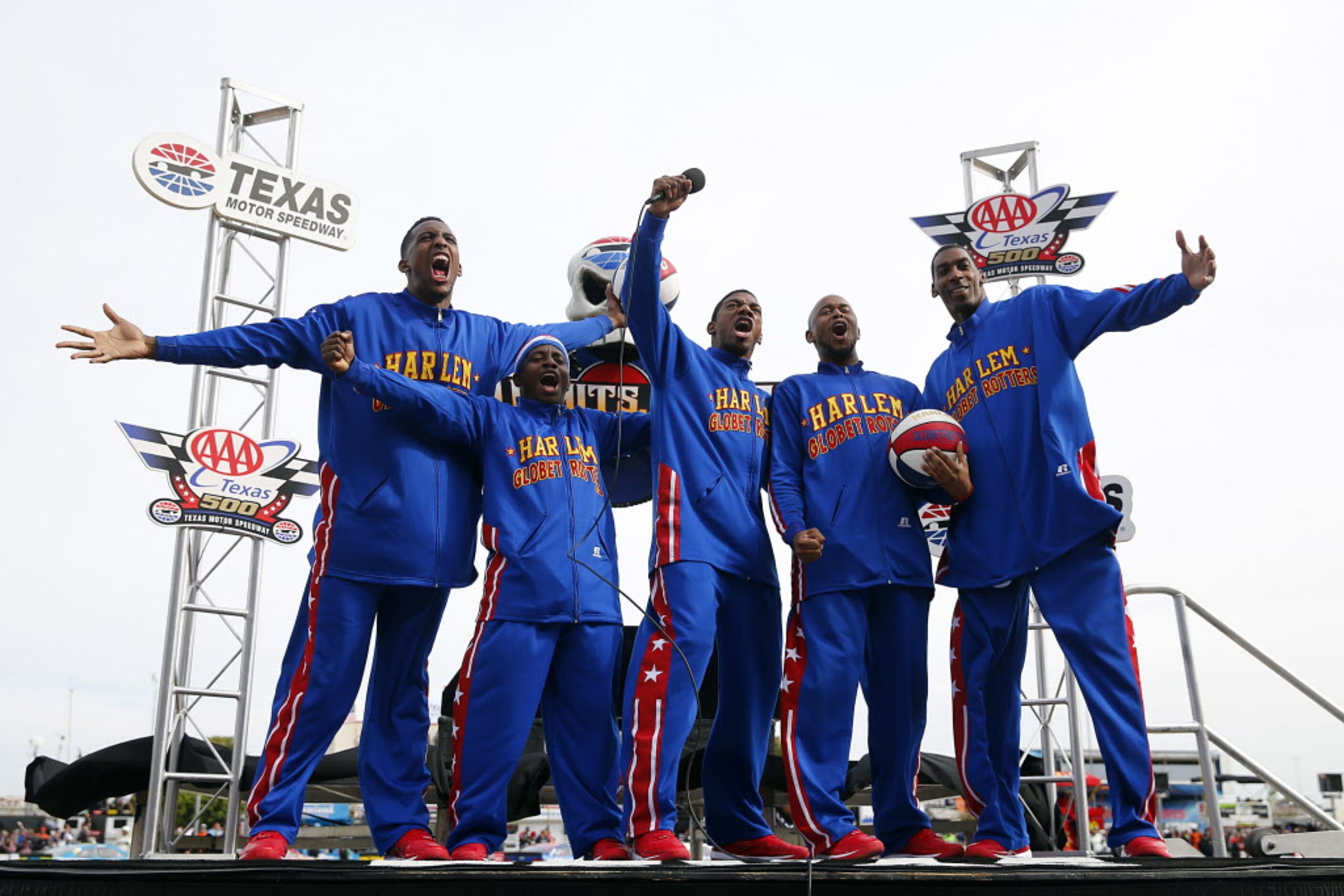 The Harlem Globtroters give the 'Gentle Start Your Engines' call before the AAA Texas 500 at...