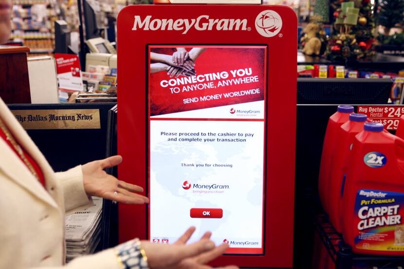 MoneyGram executive chairman Pam Patsley discusses one of the company's kiosks that allow...