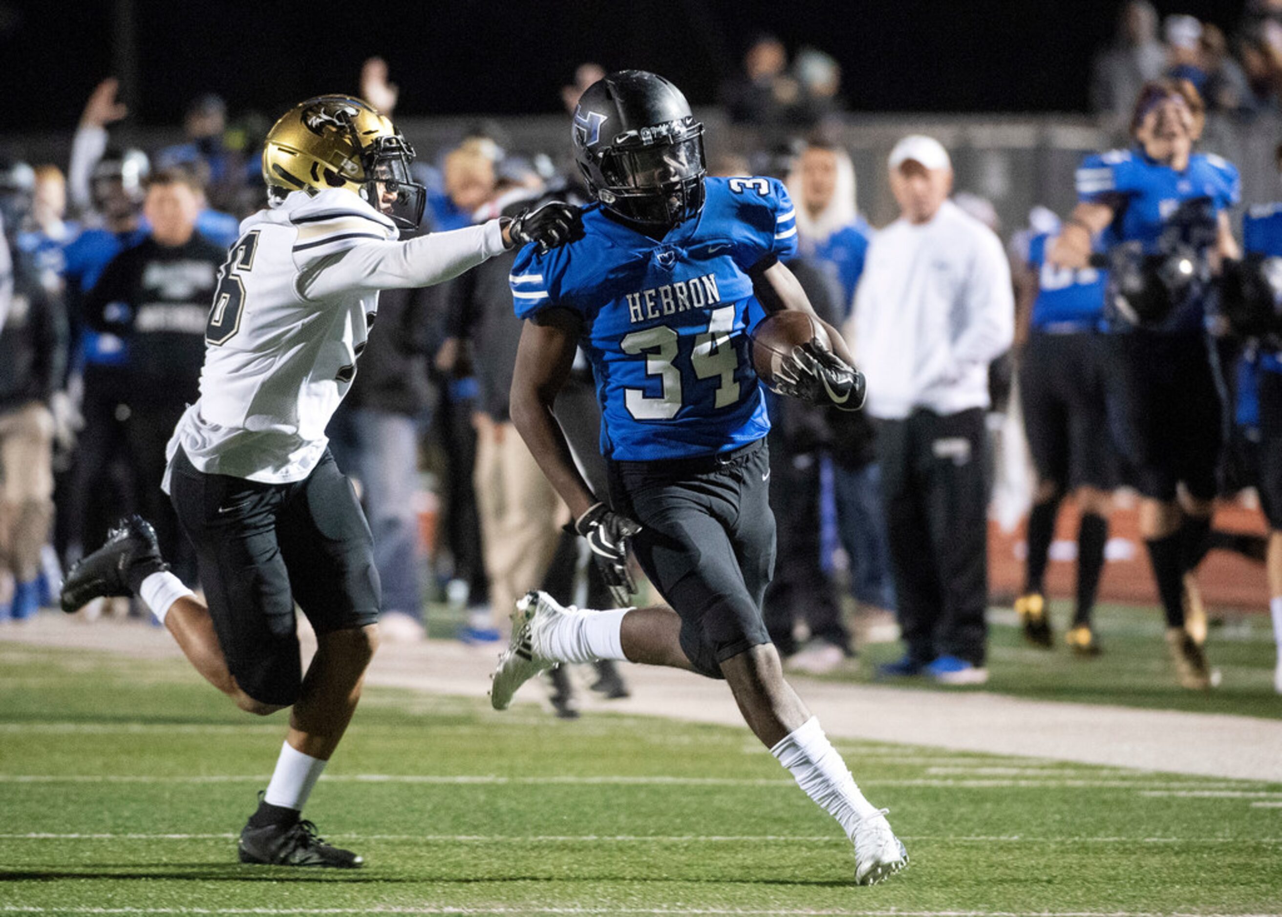 Irving sophomore defensive back Nick Cole (16) gets a hand on Hebron junior running back Kai...