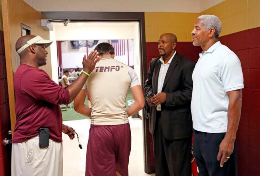 
Frisco Heritage football coach Kent Laster (left) introduced players to Davis and former...