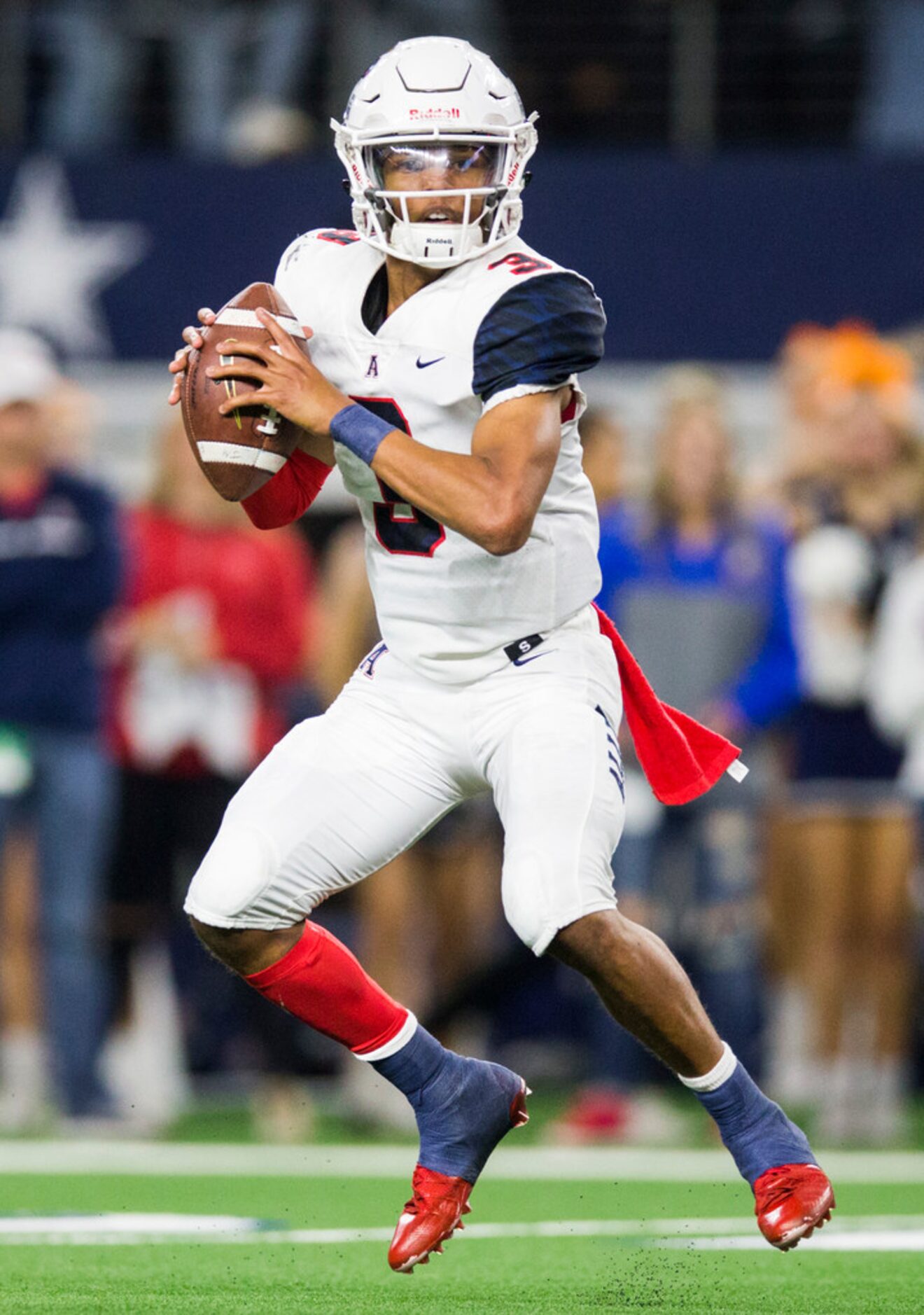 Allen quarterback Raylen Sharpe (3) looks for a receiver during the second quarter of a...