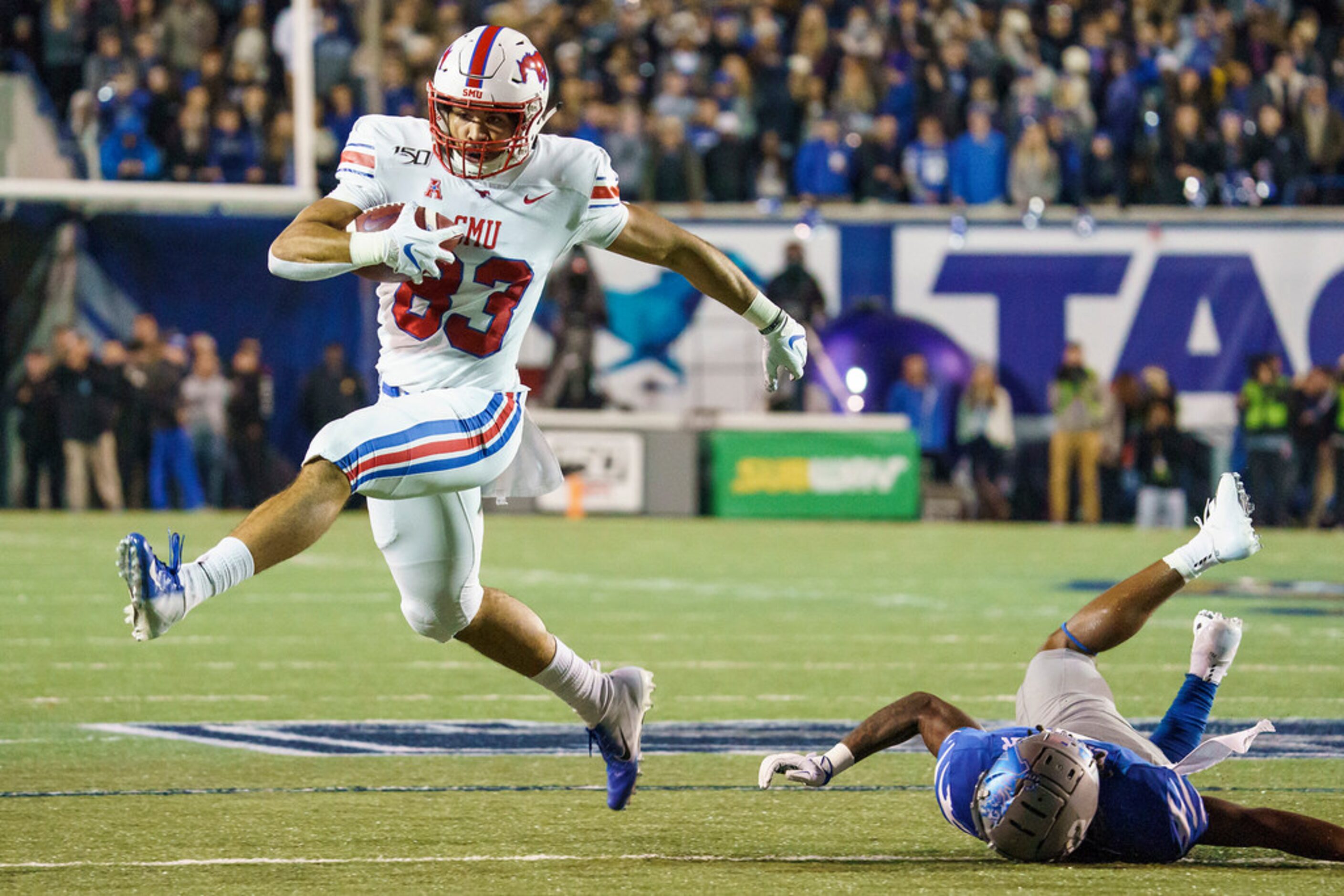 SMU tight end Kylen Granson (83) gets past Memphis defensive back T.J. Carter (2) on a...