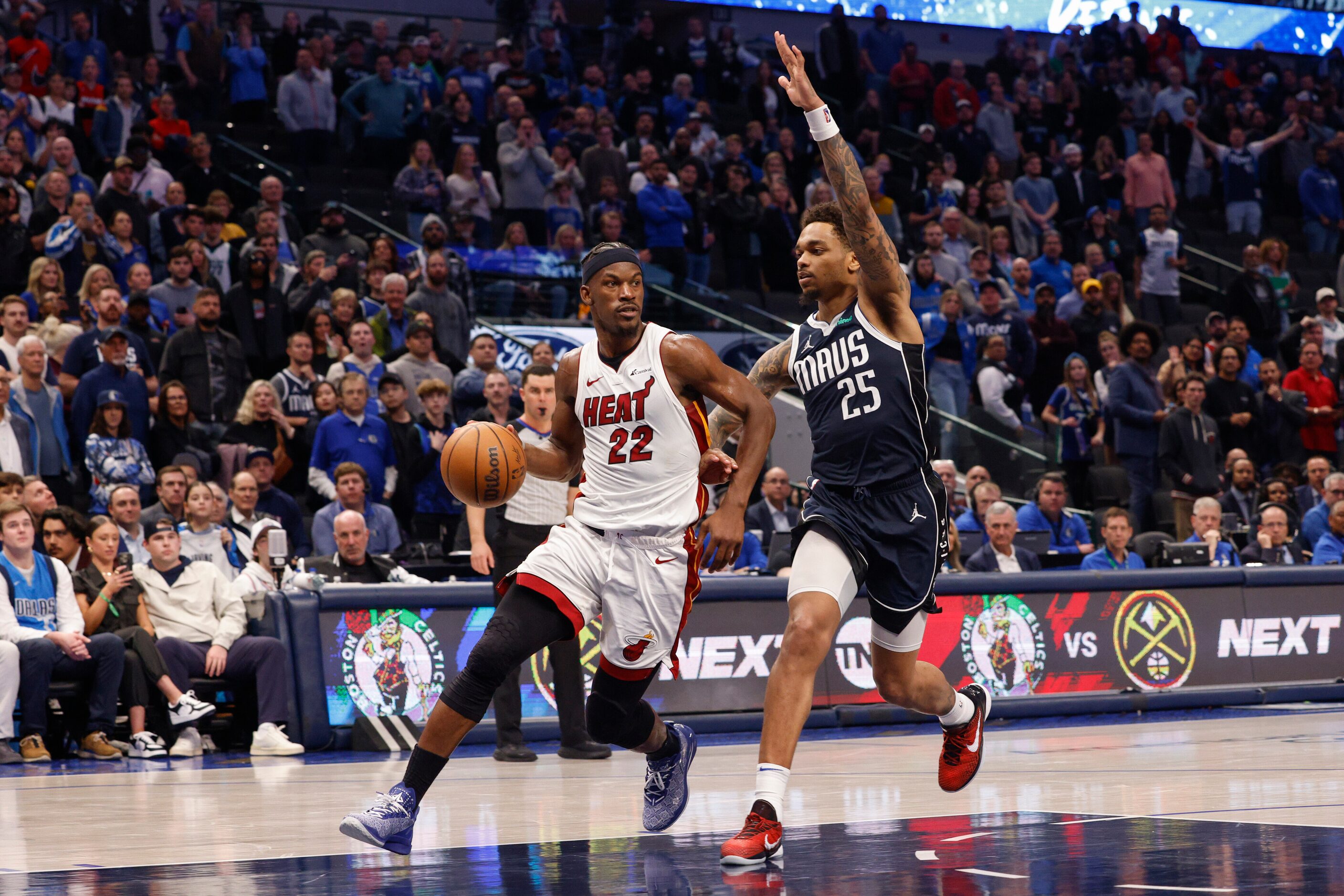 \d22\ dribbles up court alongside Dallas Mavericks forward P.J. Washington (25) during the...