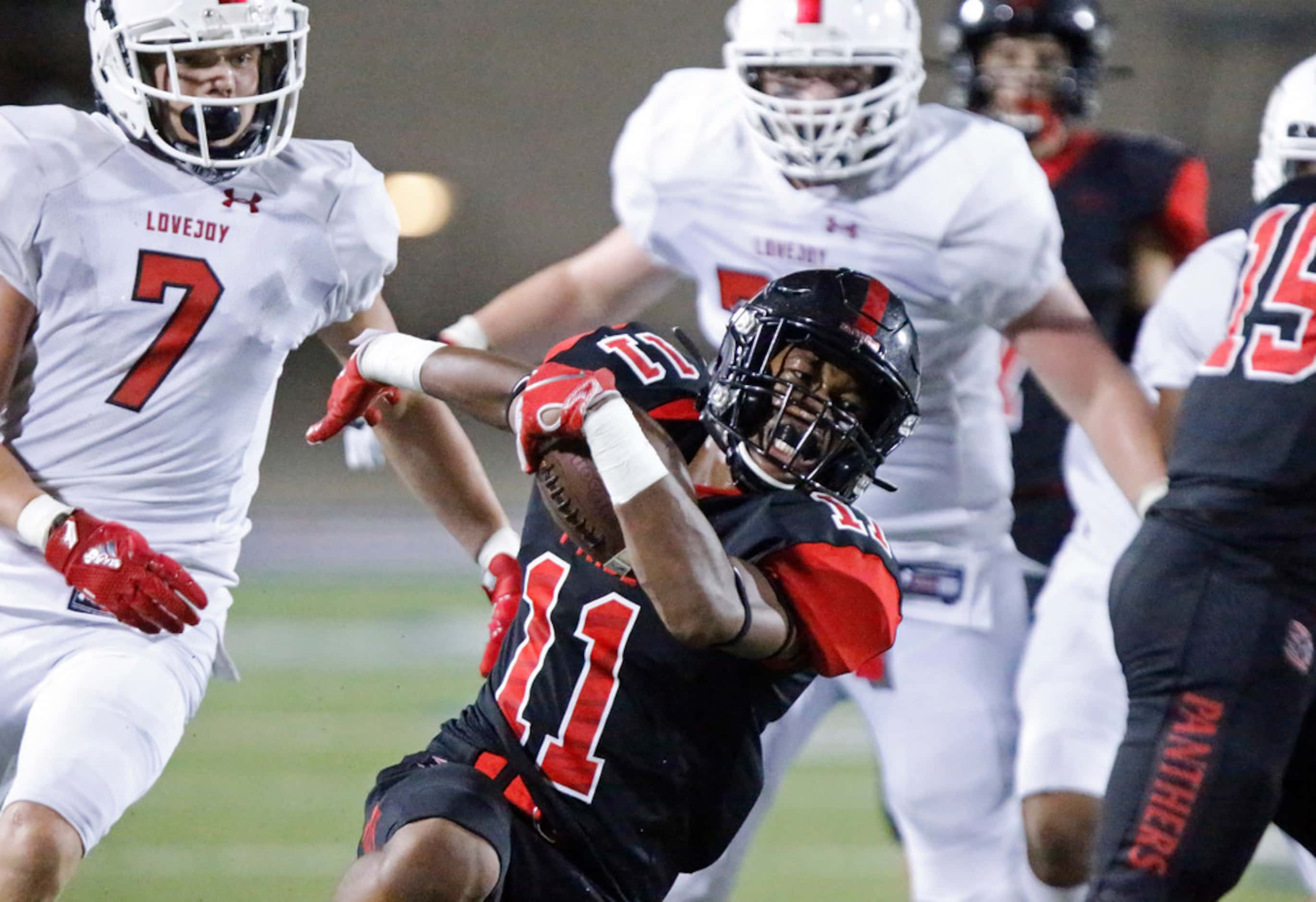 Colleyville Heritage High School defensive back Josh Ford Dobbins (11) returns an...