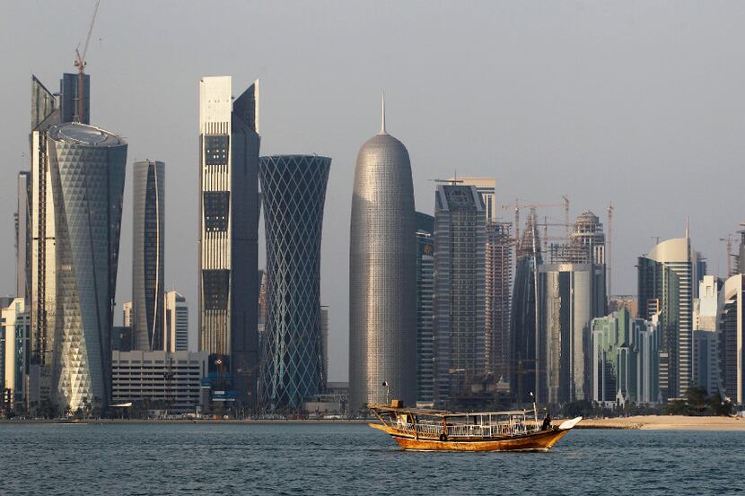 In this Jan. 6, 2011 file photo, a traditional dhow floats in the Corniche Bay of Doha,...