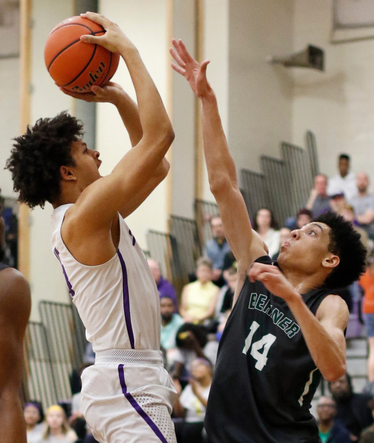 Richardson's Lorenzo Pearson lV (15) puts up a shot against the defense of Richardson...