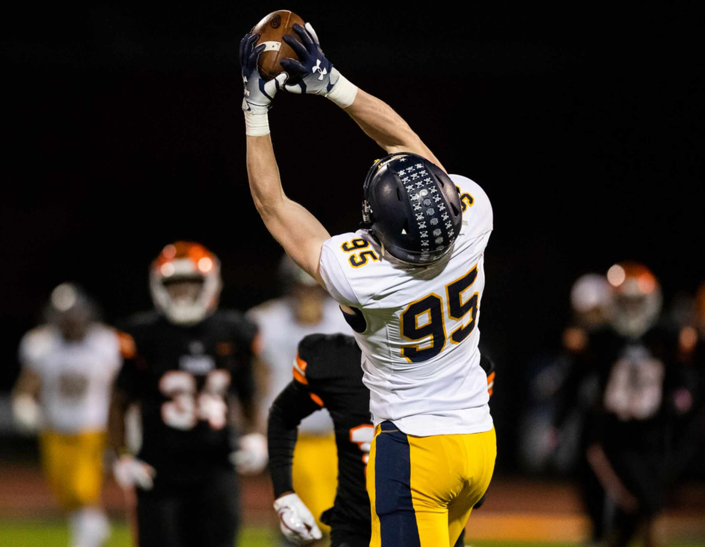 Highland Park's Jack Curtis (95) catches a pass before running to the end zone for a...