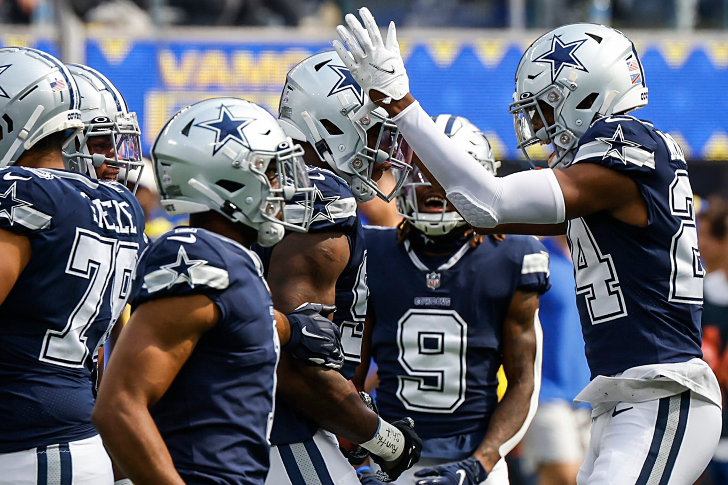 Dallas Cowboys defensive end Dorance Armstrong (92) celebrates with safety Israel Mukuamu...