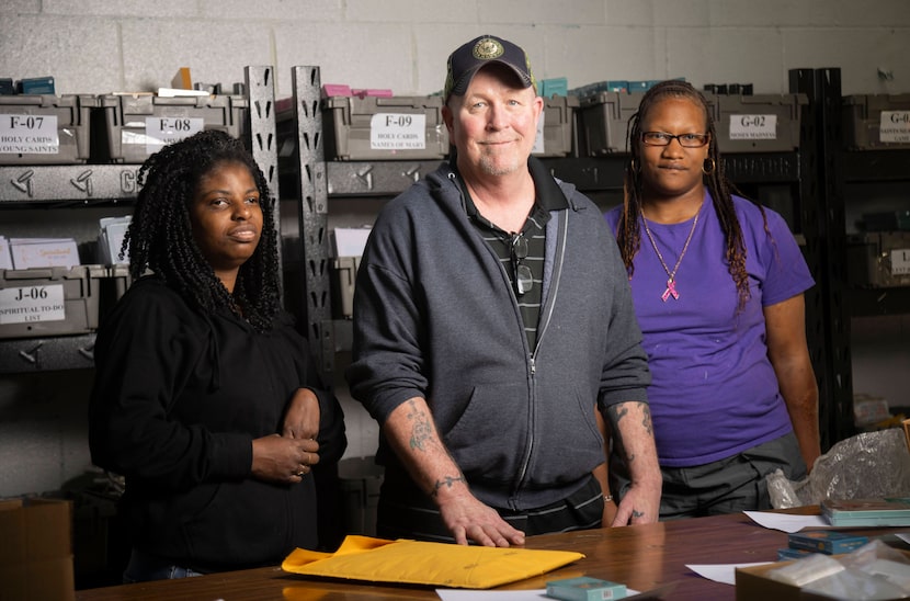 (From left) Stephanie White, Doug Wesson and Michelle Williams pose for a photo as they take...